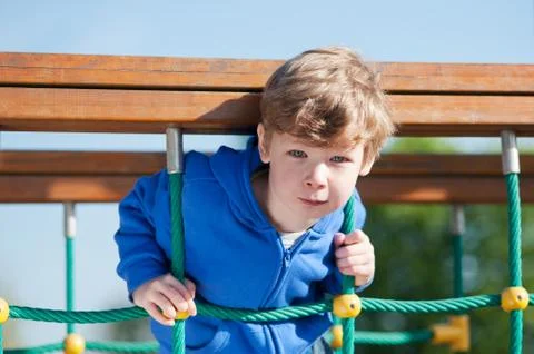 Boy playing in the park Stock Photos