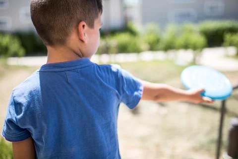 Boy playing in the park Stock Photos