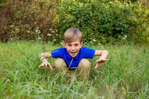 Boy playing in a park Stock Photos