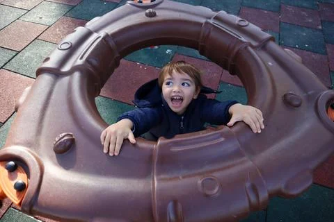 Boy Playing in The Park Stock Photos