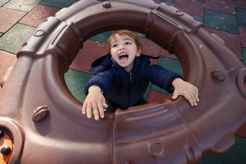 Boy Playing in The Park Stock Photos
