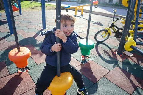 Boy Playing in The Park Stock Photos