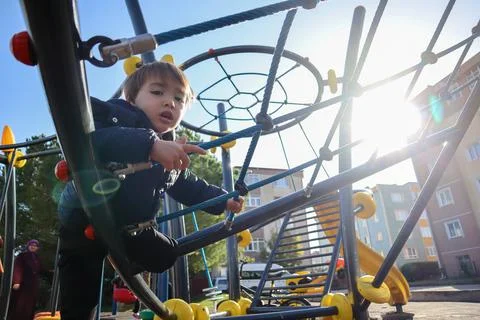 Boy Playing in The Park Stock Photos