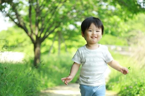 Boy playing in the park Stock Photos