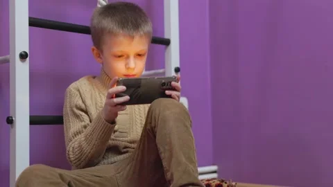 Boy playing on the phone Video stock 170659776