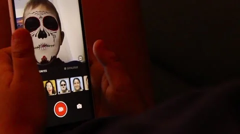 Boy playing on phone game with replacing face Stock Footage 65300481