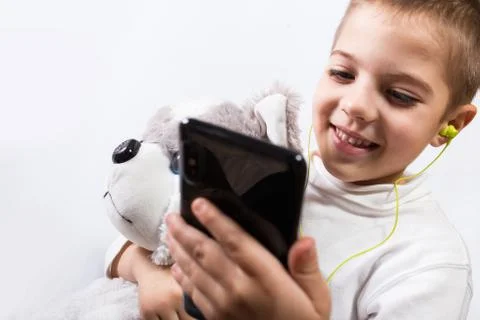 Boy playing with phone Foto stock