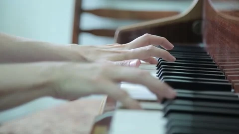Boy is playing the piano 3 Stock Footage 310026936