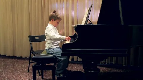Boy playing the piano Stock Footage 41071141