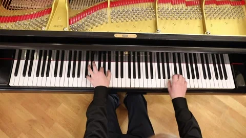 The boy is playing the piano  Stock Footage 333590886