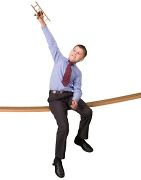 Boy playing with plane model isolated on white background Stock Photos