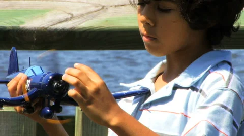 Boy Playing with Plane Series HD Stock Footage 40713886
