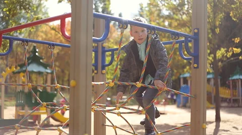 Boy playing on the playground Stock Footage 55808840