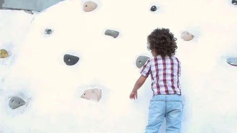 Boy playing at the playground Stock Footage 124008826