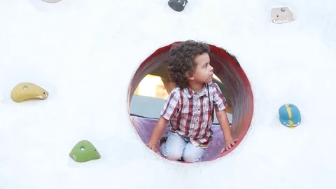 Boy playing on the playground	 Stock Footage 124008848