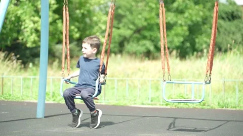 The boy is playing on the playground. Stock Footage 344811518