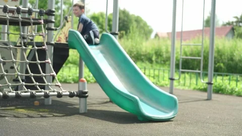 The boy is playing on the playground. Stock Footage 344811588