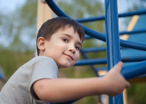 Boy playing on the playground Stock Photos