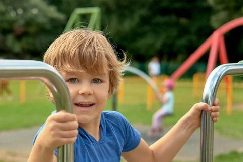Boy is playing on the playground Stock Photos