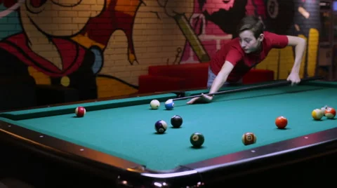 Boy playing pool billiard Stock Footage 58202438
