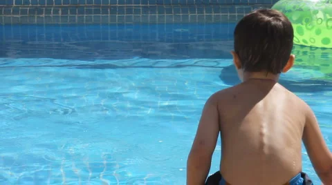 A boy playing in the pool Stock Footage 1066374