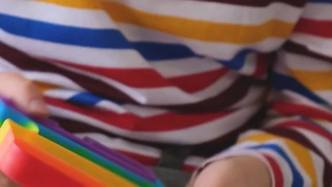 Boy playing pop it. Close-up Stock Footage 223108495