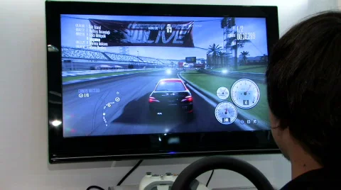 BOY PLAYING RACE VIDEO GAME Gamer Playing Industry Electronic Play Fun Racing Stock Footage 793566