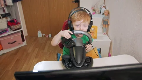 Boy Playing Races On Computer Stock Footage 168401489