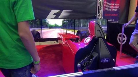Boy playing racing game with car simulator Stock Footage 71965115