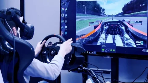 Boy Playing Racing Game Simulator. Rome, Italy. April 2017 動画素材 74538812