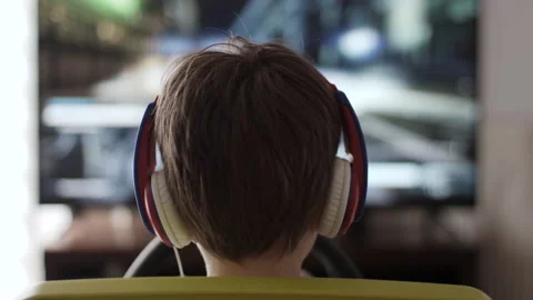 Boy Playing Racing Video Game in Game Console. Child Playing Computer Game in Stock Footage 231761878