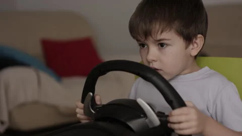 Boy Playing Racing Video Game in Game Console. Child Playing Computer Game .. Stock Footage 339302477