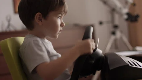 Boy Playing Racing Video Game in Game Console. Child Playing Computer Game .. Stock Footage 339302731