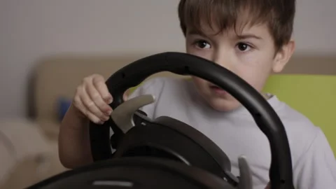 Boy Playing Racing Video Game in Game Console. Child Playing Computer Game .. Stock Footage 339303258