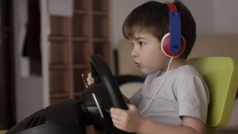 Boy Playing Racing Video Game in Game Console. Child Playing Computer Game .. Stock Footage 339304153