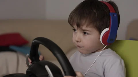 Boy Playing Racing Video Game in Game Console. Child Playing Computer Game .. Stock Footage 339304210