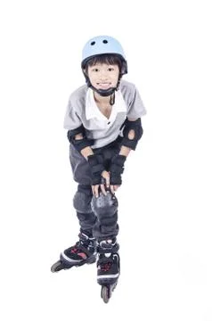 Boy playing rollerblades Stock Photos