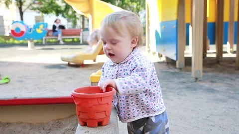 Boy playing in the sandbox Stock Footage 135250778