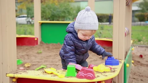 Boy playing in the sandbox Stock Footage 142144773