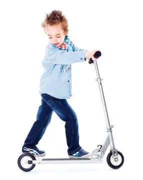Boy playing with scooter Stock Photos