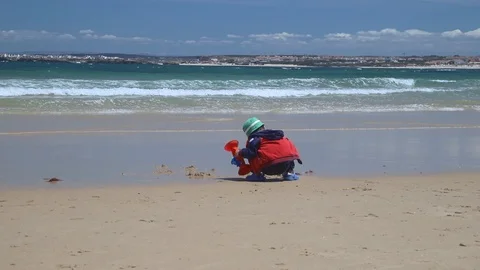 Boy playing on the sea on beach Video stock 111432730