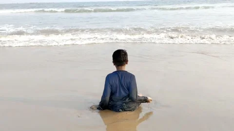 A boy  is playing with sea waves in sandy beach- HD(4k video) Stock Footage 231554124