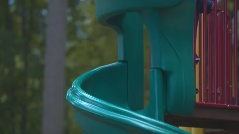 Boy Playing on a Slide at a Park Stock Footage 91624616