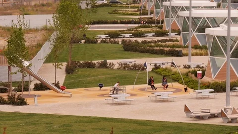 Boy playing on a small caroussel in Parque Felipe VI in Logroño, La Rioja,Spain Stock Footage 97941701