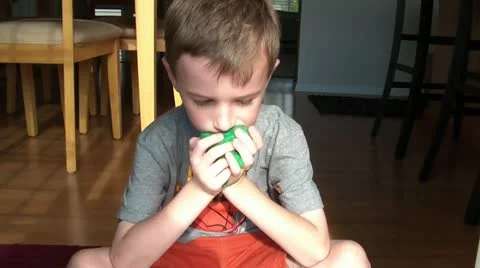 Boy Playing with Small Stuffed Animal Stock Footage