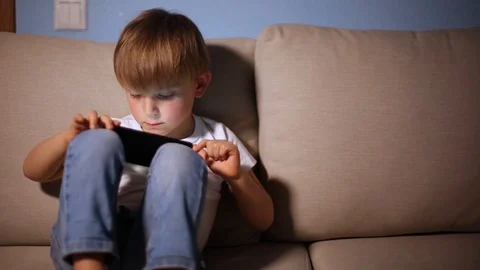 Boy playing with smart phone Stock Footage 102801642