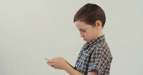 Boy playing with a smartphone Stock Footage 69765053
