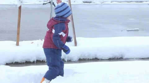 Boy playing in snow Video stock 11634101