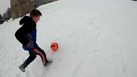 A boy is playing in the snow Stock Footage 155308871