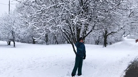 Boy playing with snow Video stock 205322254